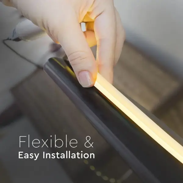 Flexible LED strip installation with hand demonstrating ease of use. Perfect for versatile lighting solutions.