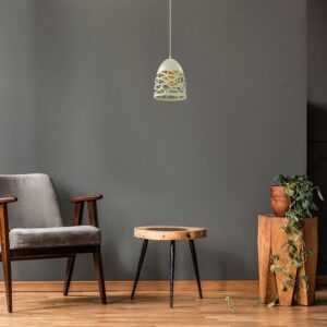 Minimalist living room with vintage armchair, wooden side table, hanging lamp, and plant decor.