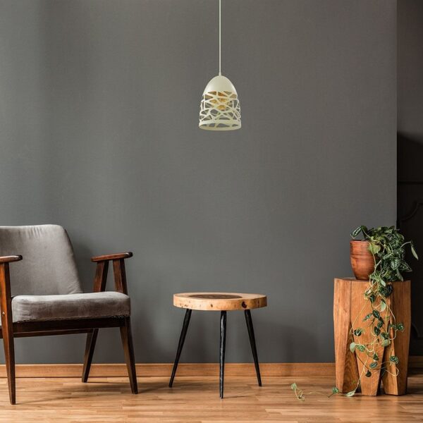 Minimalist living room with vintage armchair, wooden side table, hanging lamp, and plant decor.